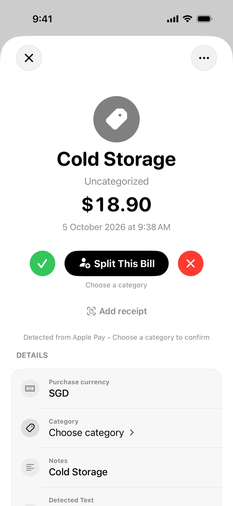 A purchase detected from Apple Pay, waiting for review in wym: the merchant, the amount and the time, with no category yet. A tick adds it and a cross ignores it, either side of a Split This Bill button.